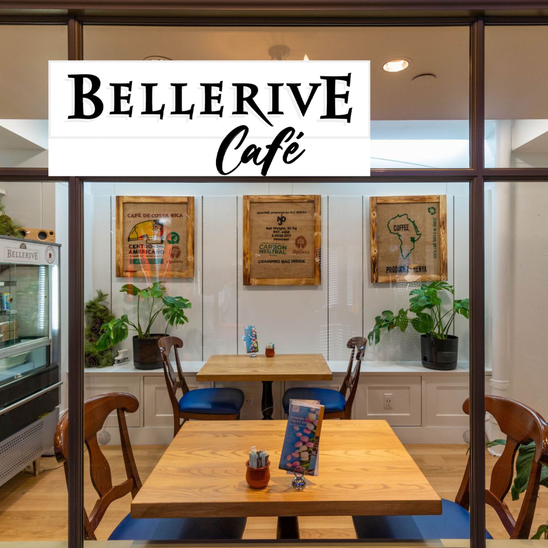 Hotel corridor overlooking the windowed exterior of Le Bellerive Café.