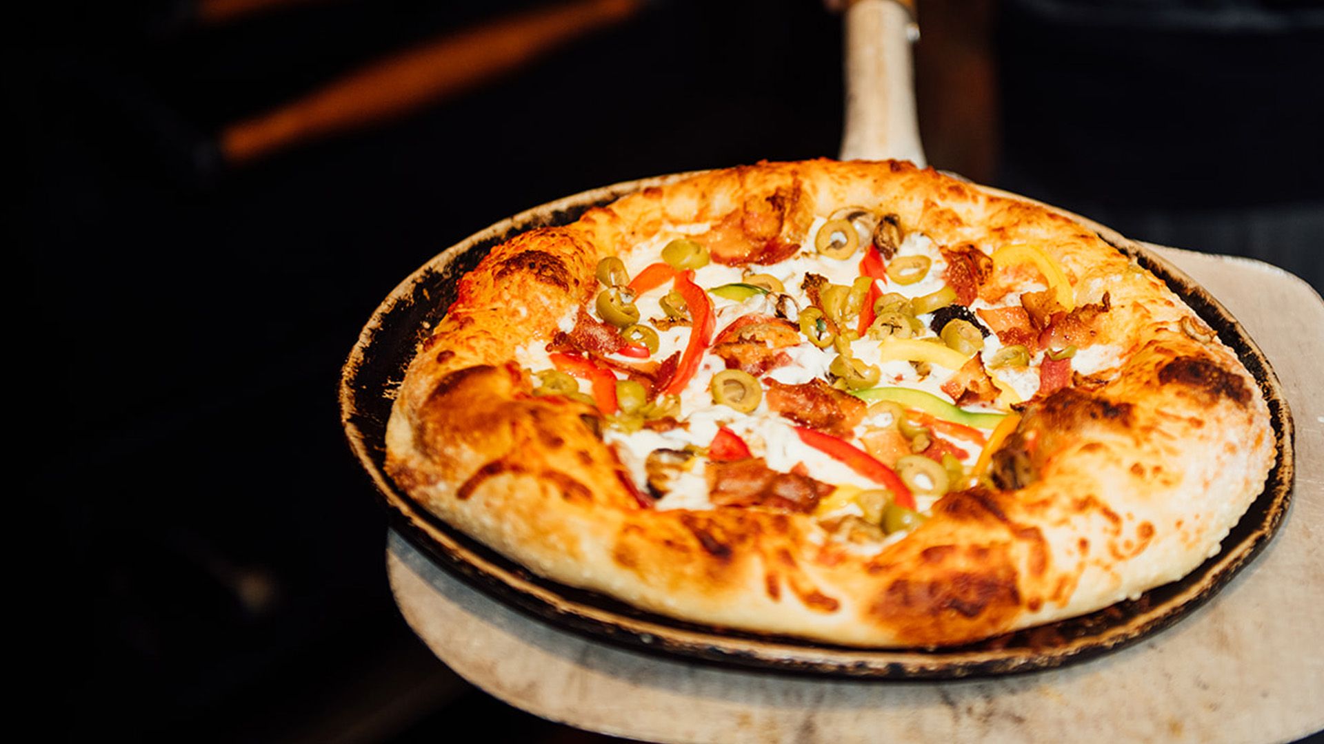 Supreme pizza, fresh out of the oven