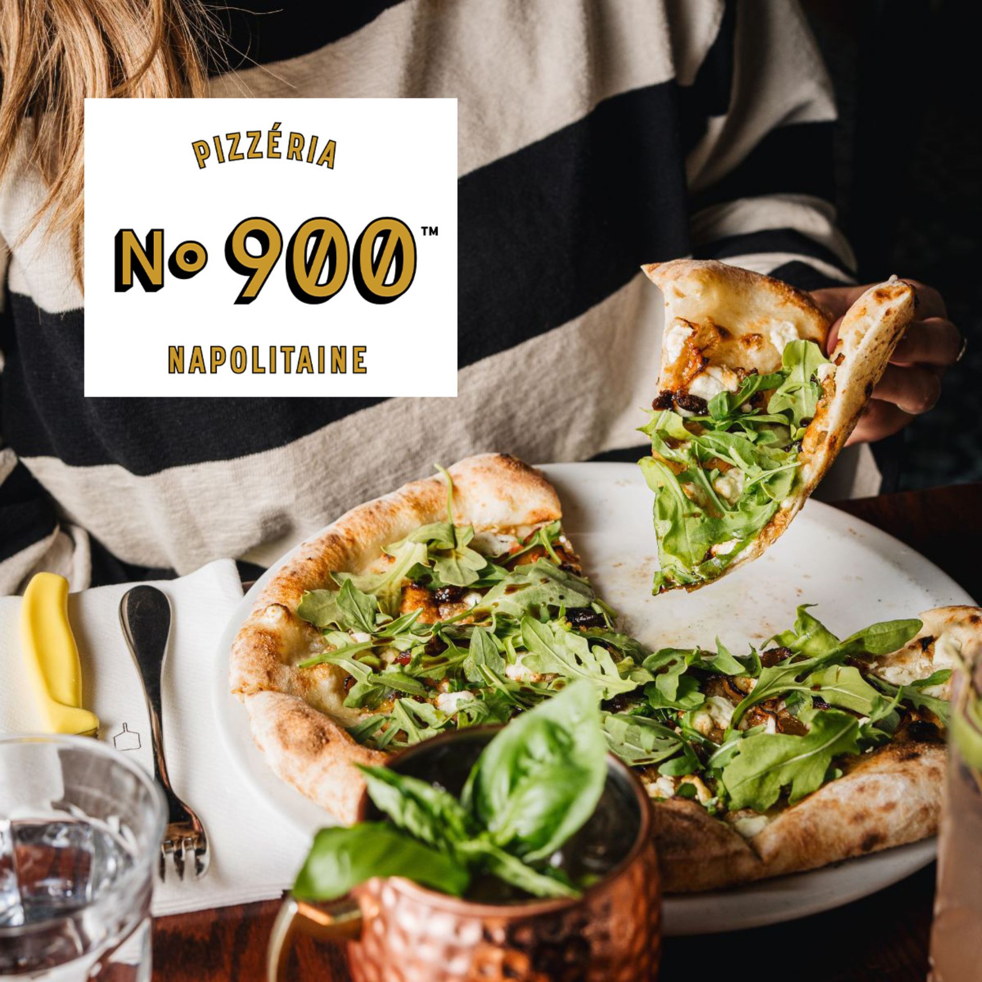 Woman taking a slice of Neapolitan pizza on a plate